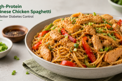 A portion of Chinese chicken spaghetti in a wok featuring snow peas, carrots, and chicken pieces.